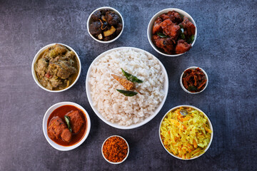 Kerala special food sadhya in banana leaf plate with Chicken fry Duck roast Beef fry Fish curry Cabbage thoran. Festival food for Christmas Easter celebration Kerala India Sri Lanka