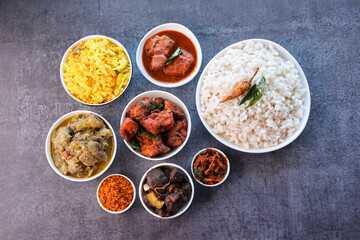 Kerala special food sadhya in banana leaf plate with Chicken fry Duck roast Beef fry Fish curry Cabbage thoran. Festival food for Christmas Easter celebration Kerala India Sri Lanka