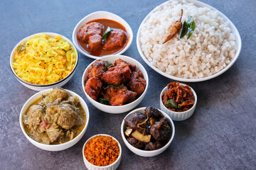 Kerala special food sadhya in banana leaf plate with Chicken fry Duck roast Beef fry Fish curry Cabbage thoran. Festival food for Christmas Easter celebration Kerala India Sri Lanka