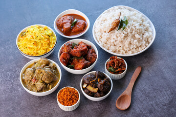 Kerala special food sadhya in banana leaf plate with Chicken fry Duck roast Beef fry Fish curry Cabbage thoran. Festival food for Christmas Easter celebration Kerala India Sri Lanka