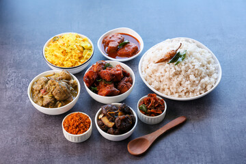 Kerala special food sadhya in banana leaf plate with Chicken fry Duck roast Beef fry Fish curry Cabbage thoran. Festival food for Christmas Easter celebration Kerala India Sri Lanka