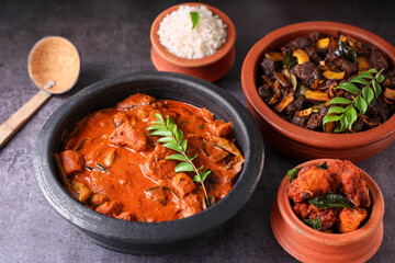 Kerala fish curry coconut milk gravy , cooking spicy Goan fish curry , Indian red fish curry Bengali fish curry in coconut milk Kolkata, India Sri Lanka. Lankan food.