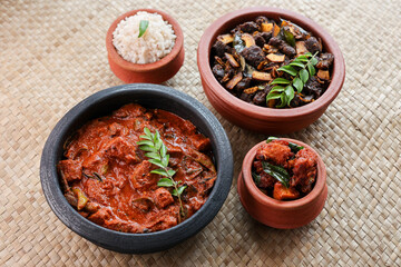 Kerala fish curry coconut milk gravy , cooking spicy Goan fish curry , Indian red fish curry Bengali fish curry in coconut milk Kolkata, India Sri Lanka. Lankan food.