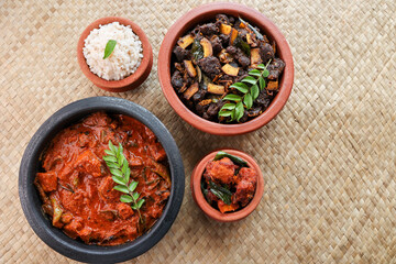 Kerala fish curry coconut milk gravy , cooking spicy Goan fish curry , Indian red fish curry Bengali fish curry in coconut milk Kolkata, India Sri Lanka. Lankan food.