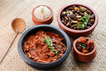 Kerala fish curry coconut milk gravy , cooking spicy Goan fish curry , Indian red fish curry Bengali fish curry in coconut milk Kolkata, India Sri Lanka. Lankan food.