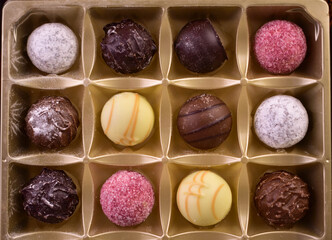 Obraz na płótnie Canvas Assorted chocolates with liqueur fillings in a box. 