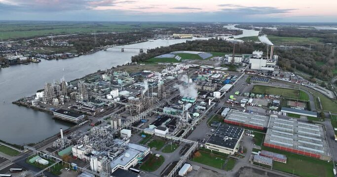 The manufacturing process, materials, sustainability, and innovation in a factory specializing in synthetic polymers and plastics. Birds eye aerial drone view. Dordrecht, The Netherlands.