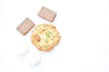 mixed nut cookie and chocolate biscuit with marshmallow arranging on white background 