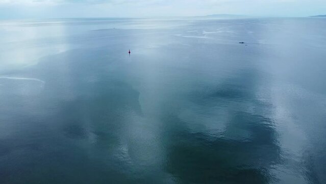 Aerial view of the sea surface. The ship is sailing on the sea. 