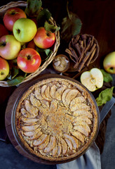 Homemade apple pie on dark rustic background, top view. Classic autumn dessert