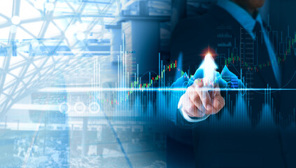 A businessman looking at growth and asset investment chart on trends in the business, finance,...