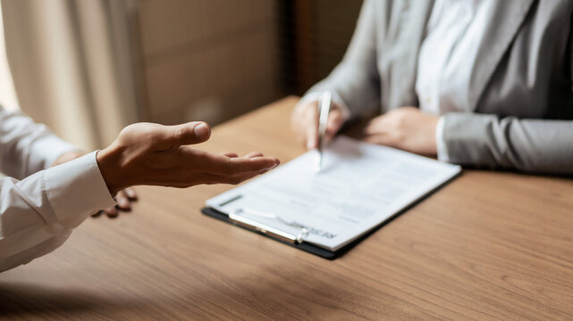 Male candidate job interviewing and answering question about curriculum vitae with HR manager woman