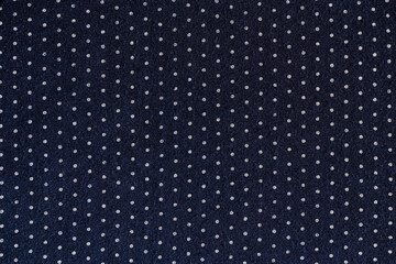 abstract background of dark blue and white polka dot knit fabric texture close up - obrazy, fototapety, plakaty