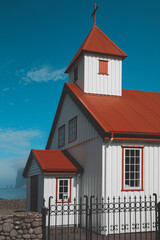 white church with red roof at tjornuvik village