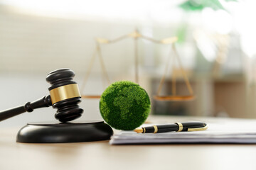 Green law concept. international environmental law Climate or environmental justice Law on green forest conservation economy Environmental protection. Legal hammer placed on the desk - obrazy, fototapety, plakaty