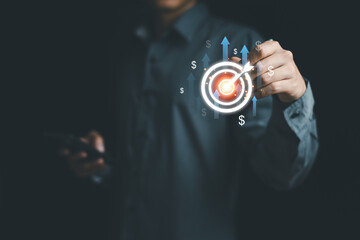 Goals and planning for success in marketing business, target setting achieve the objective concept. Business growth, profits and losses of company . Man pointing target board. Free copy space