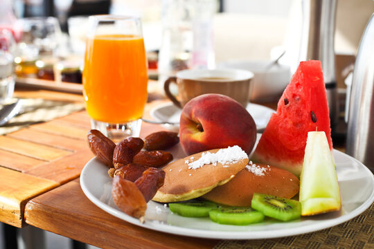 Breakfast in the morning with pancaces and fruits