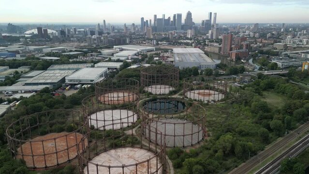 View of Bromley-by-Bow Gasholders and Canary Wharf Skyline, London