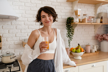 young pretty woman cooking at home, morning kitchen, healthy food