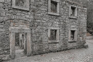 Fototapeta na wymiar Ruins of an old stone water mill.