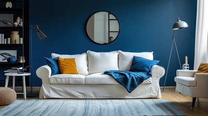 Modern designer living room in deep blue with a white  sofa with pillows, mirror< chair and carpet on the floor