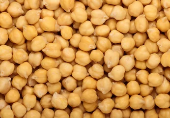 Foto op Aluminium Cooked soaked chickpea beans close up background © breakingthewalls