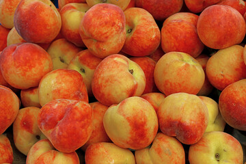 Fresh peaches on market stall