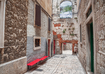 Fototapeta na wymiar Ancient stone buildings on the streets of Split in Croatia.