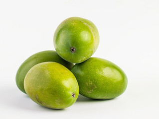Obraz premium Fresh green tropical mangoes isolated on white background. Minimalist style. 