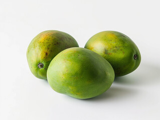 Obraz premium Fresh green tropical mangoes isolated on white background. Minimalist style. 