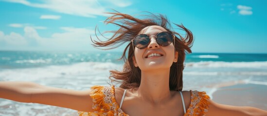 Naklejka premium Mixed race Asian Caucasian girl enjoying summer freedom on beach vacation.