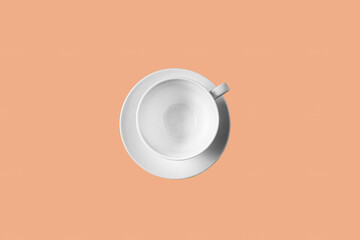 white empty tea cup on trendy peach fuzz color - trendy color of 2024 year.