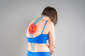 Intervertebral spine hernia, pain between the shoulder blades, woman suffering from backache,...
