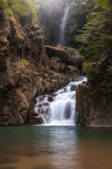 Fototapeta premium Beautiful waterfall Namtok Phlio, Phlio waterfall national park in Chanthaburi Province Thailand.