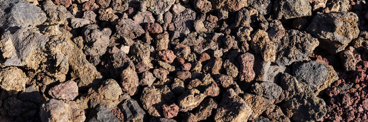 Panoramic image. Small red and gray volcanic stones. Tenerife. Canary Island, Spain