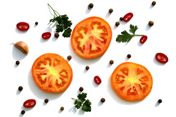 Texture of chopped tomatoes, hot peppers and parsley on a white background.
