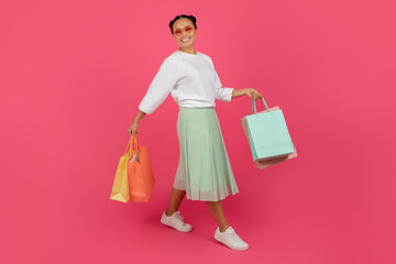 Big Sales. Excited Happy Asian Woman Holding Bright Shopping Bags In Hands