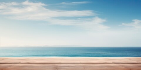 Fototapeta premium Empty table for displaying products with a scenic view of the sea and vibrant sky.