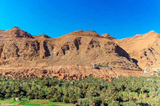 Landscape view of Atlas mountains and oasis around Douar Ait Boujane village in Todra gorge in Tinghir, Morocco.