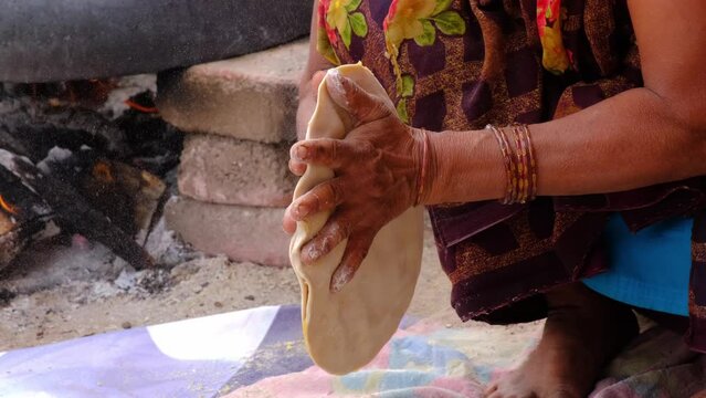 Indian Women Preparing mande ( PURAN POLI ) - typical Maharashtrian Sweet food in Bhimthadi Jatra, Pune, To uplift the culture and traditional Food with an active platform.