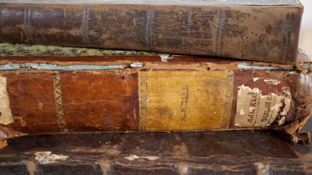 Close up of very old Yiddish Jewish  books. Restoration of books in archives. Vilnius, Lithuania - 05 15 2023.