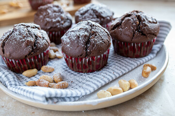 Chocolate muffins with peanuts