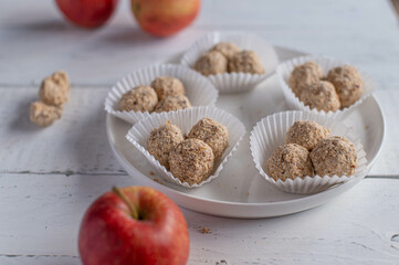 Energy balls. Healthy sweet food or snack with apple chips, dates, oats and cinnamon
