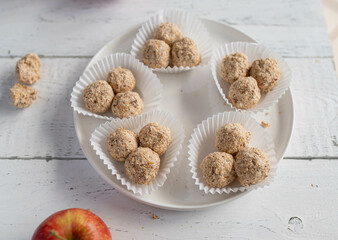 Energy balls. Healthy sweet food or snack with apple chips, dates, oats and cinnamon