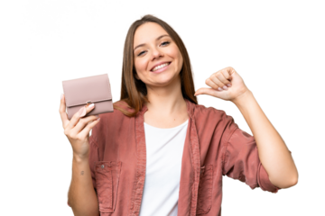 Young blonde woman holding a wallet over isolated chroma key background proud and self-satisfied