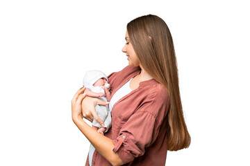 Young blonde woman  with her newborn baby over isolated chroma key background with happy expression