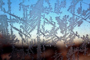 Frosty natural pattern on winter window glass. Natural background.