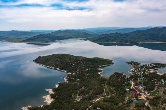 beautiful shore of large lake from the throne, holiday houses among a beautiful forest, bright sunny summer day, nature of Kazakhastan, Ust-Kamenogorsk