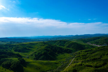 Fototapeta na wymiar Drone view on forested mountain peaks, beautiful valleys, wildlife of Kazakhastan