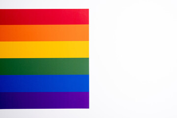 Rainbow flag on a light background. LGBT flag. LGBTQIA Pride Month in June. Lesbian-gay-bisexual-transgender. Gender equality. Human rights and tolerance. Rainbow flag

